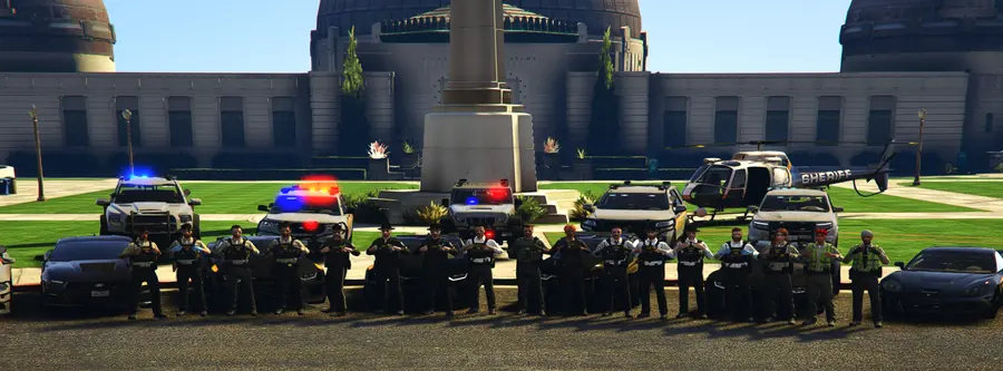 The sheriff's department lined up in front of the observatory with patrol cars and a helicopter